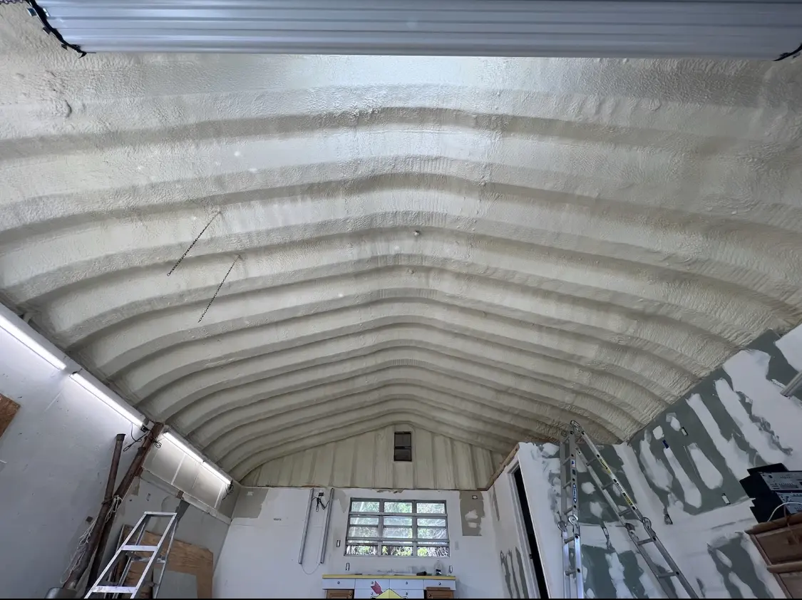 Spray polyurethane foam applied to the underside of a metal roof deck in Elmwood Park